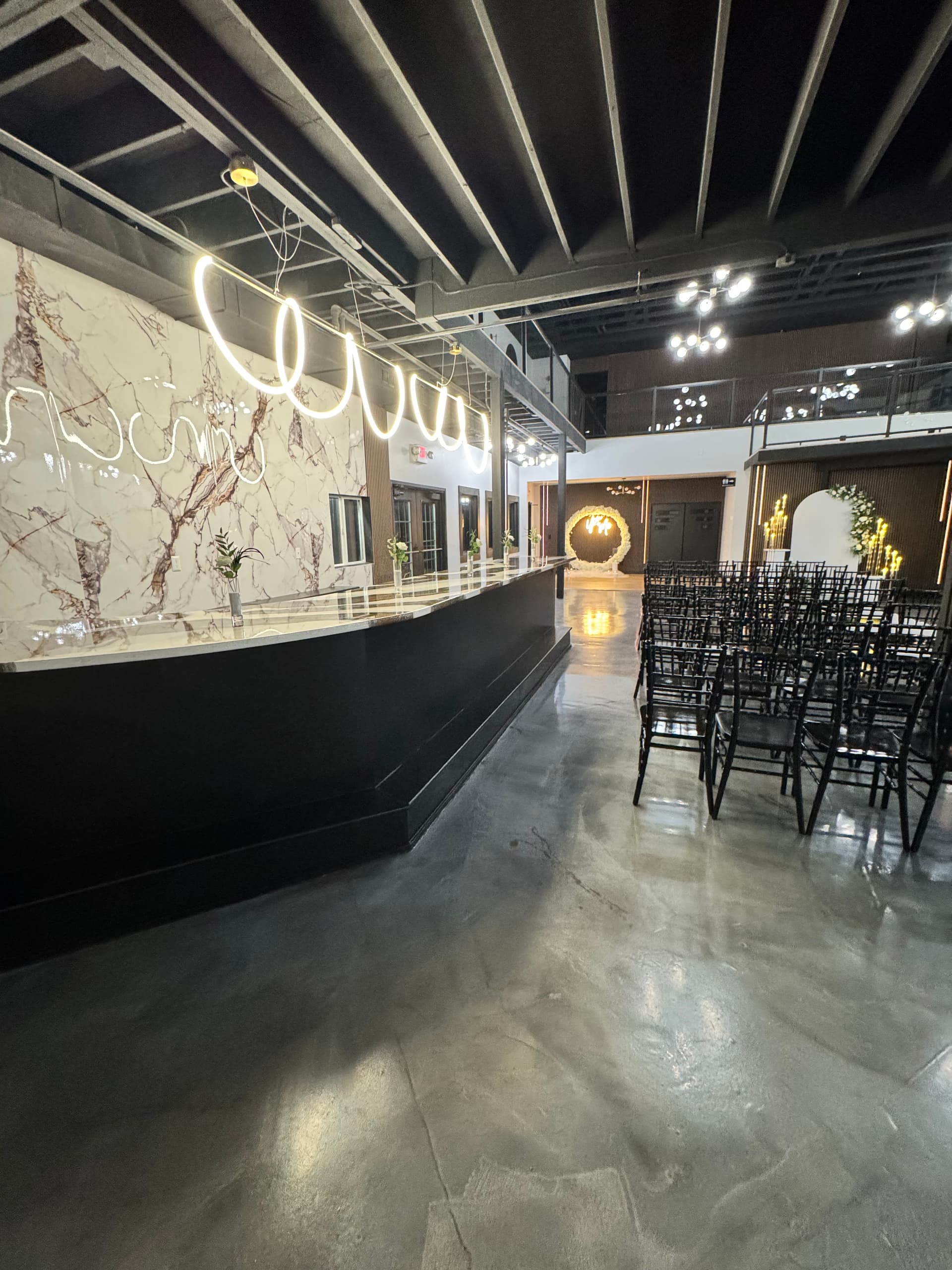 Marble bar and ceremony seating at Altar'd Event Venue